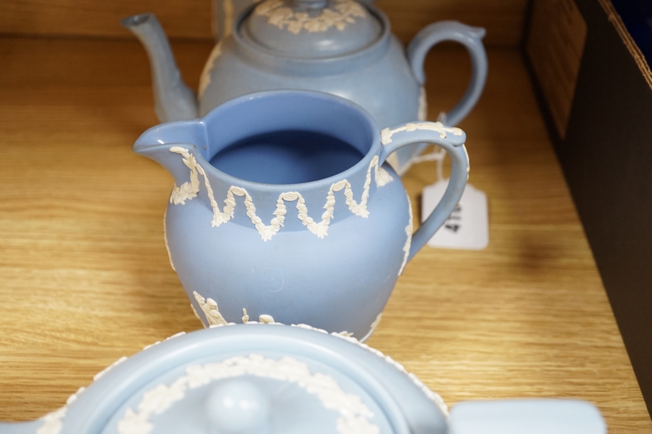 A group of Wedgwood and Wedgwood-style jasperware teapots and jugs.